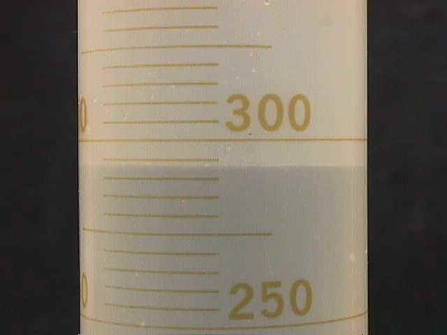 Flat meniscus of water in plastic. {104vol14.jpg (12720 bytes)}