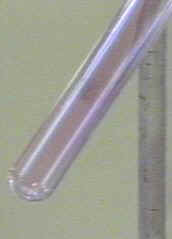 Crystals of iodine forming after cooling [1sublim5.JPG (8186 bytes)]