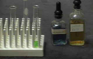 Mixing yelow and blue food color solutions [1rx7ybg.JPG]